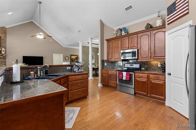 512 Golson Rd, Prattville, AL 36067 - kitchen with appliances with stainless steel finishes, ornate columns, a sink, tile countertops, and ceiling fan
