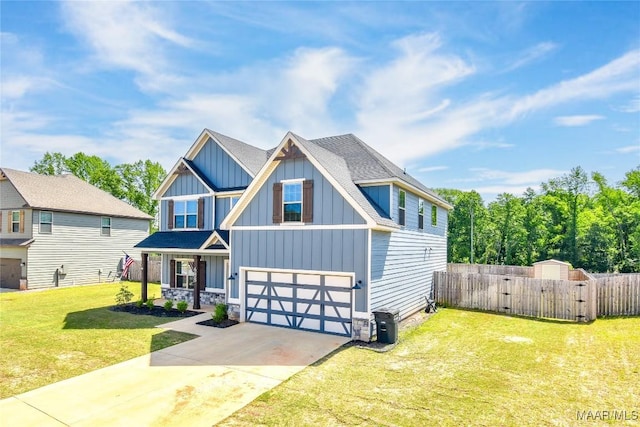 688 Tiger Trl, Opelika, AL 36804 - craftsman-style home with board and batten siding, concrete driveway, an attached garage, a gate, and stone siding