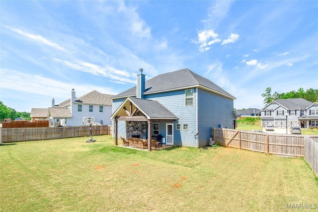 688 Tiger Trl, Opelika, AL 36804 - rear view of house with a patio area and a chimney