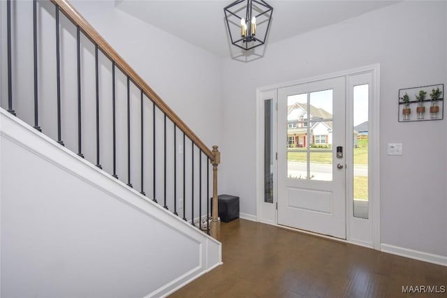 688 Tiger Trl, Opelika, AL 36804 - foyer entrance featuring stairs, wood finished floors, baseboards, and a chandelier