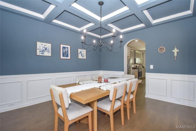 688 Tiger Trl, Opelika, AL 36804 - dining area featuring coffered ceiling, arched walkways, beamed ceiling, dark wood-style floors, and a wainscoted wall