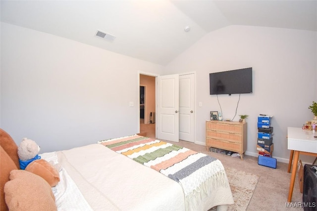 688 Tiger Trl, Opelika, AL 36804 - bedroom with lofted ceiling, light colored carpet, and baseboards