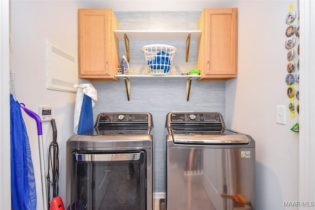 688 Tiger Trl, Opelika, AL 36804 - washroom with washer and clothes dryer and cabinet space