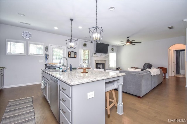 688 Tiger Trl, Opelika, AL 36804 - kitchen with ceiling fan, arched walkways, a kitchen bar, stainless steel dishwasher, and recessed lighting