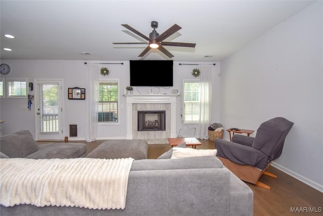 688 Tiger Trl, Opelika, AL 36804 - living room with a ceiling fan, a tiled fireplace, wood finished floors, baseboards, and recessed lighting