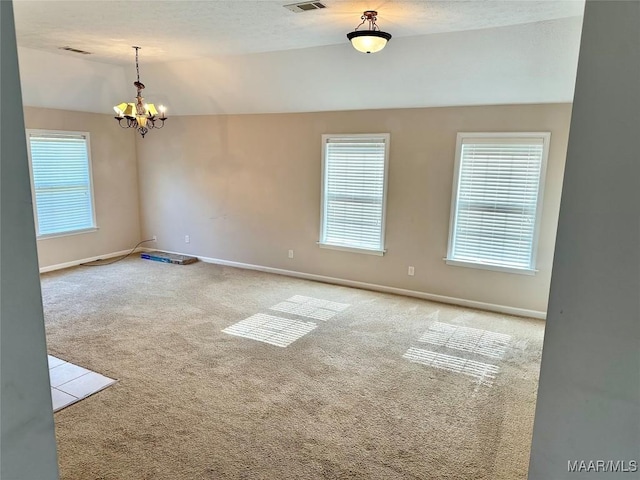 10617 Harcourt Trce, Montgomery, AL 36117 - carpeted spare room featuring vaulted ceiling, baseboards, and a chandelier