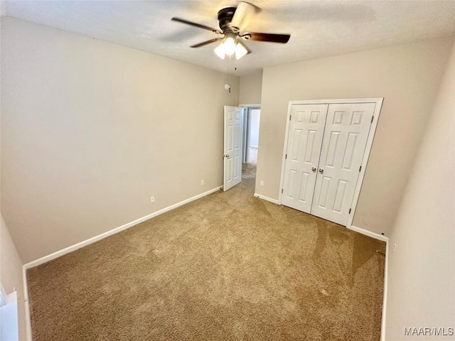 10617 Harcourt Trce, Montgomery, AL 36117 - unfurnished bedroom featuring carpet flooring, baseboards, a closet, and a ceiling fan
