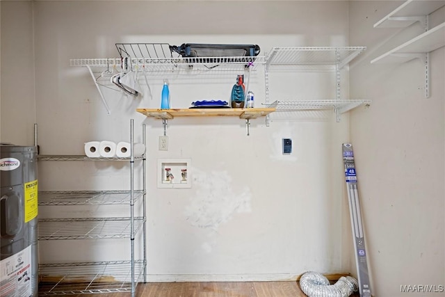 6390 County Road 37, Valley Grande, AL 36701 - laundry room with water heater, hookup for a washing machine, and wood finished floors