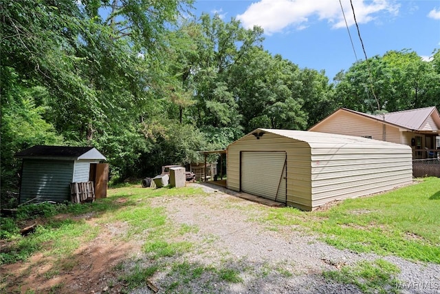 6390 County Road 37, Valley Grande, AL 36701 - view of yard with dirt driveway and a detached garage