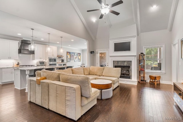 1478 Trolley Rd, Prattville, AL 36066 - living area with a premium fireplace, ceiling fan, dark wood-type flooring, high vaulted ceiling, and recessed lighting