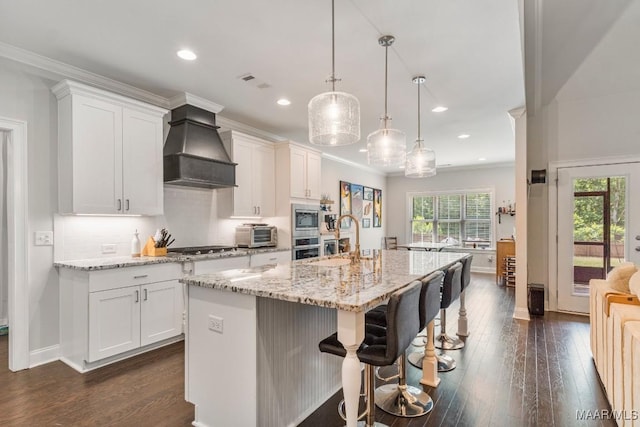 1478 Trolley Rd, Prattville, AL 36066 - kitchen featuring custom exhaust hood, stainless steel appliances, a sink, dark wood-style flooring, and white cabinetry