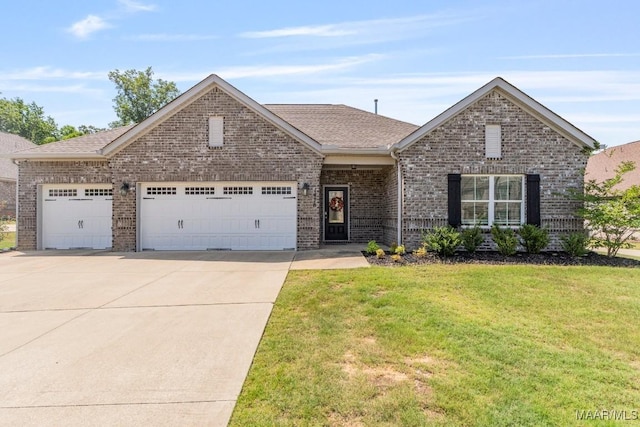 1478 Trolley Rd, Prattville, AL 36066 - view of front of house with brick siding, concrete driveway, an attached garage, a front lawn, and roof with shingles