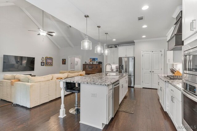 1478 Trolley Rd, Prattville, AL 36066 - kitchen featuring stainless steel appliances, a sink, open floor plan, a breakfast bar area, and light stone countertops