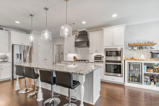 1478 Trolley Rd, Prattville, AL 36066 - kitchen with stainless steel appliances, a sink, custom exhaust hood, crown molding, and beverage cooler