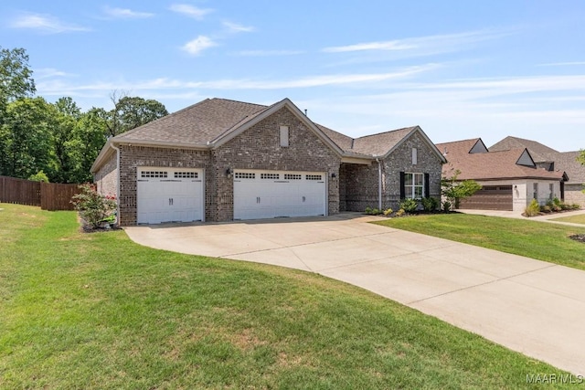 1478 Trolley Rd, Prattville, AL 36066 - view of front facade with concrete driveway, a garage, brick siding, and roof with shingles