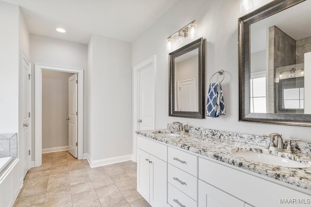 1478 Trolley Rd, Prattville, AL 36066 - full bath featuring double vanity, baseboards, a tub to relax in, and a tile shower