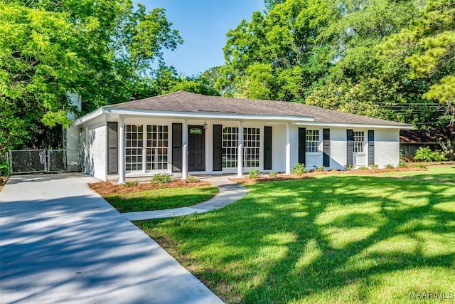 3212 Mcgehee Rd, Montgomery, AL 36111 - ranch-style home featuring a front lawn, concrete driveway, a gate, and a porch