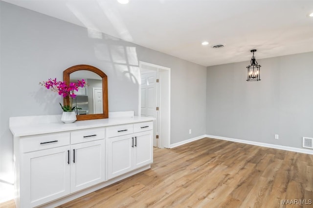 3212 Mcgehee Rd, Montgomery, AL 36111 - interior space featuring light wood-style flooring, baseboards, recessed lighting, and a chandelier