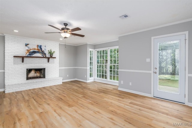 3212 Mcgehee Rd, Montgomery, AL 36111 - unfurnished living room featuring wood finished floors, ceiling fan, plenty of natural light, baseboards, and crown molding