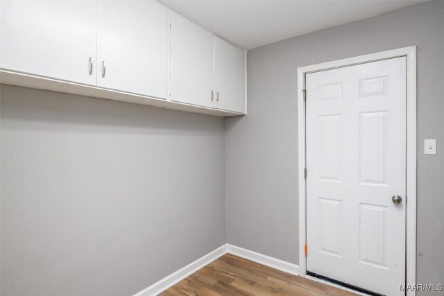 3212 Mcgehee Rd, Montgomery, AL 36111 - laundry room with wood finished floors and baseboards