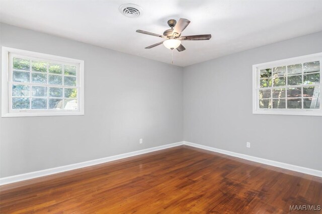 3212 Mcgehee Rd, Montgomery, AL 36111 - unfurnished room with baseboards, wood finished floors, and ceiling fan