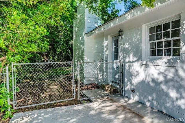 3212 Mcgehee Rd, Montgomery, AL 36111 - view of property exterior featuring a chimney and a gate