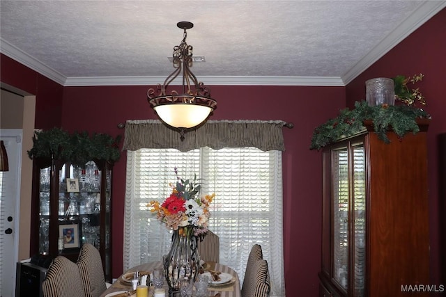 663 Hobbie Rd, Montgomery, AL 36105 - dining space with a textured ceiling and crown molding