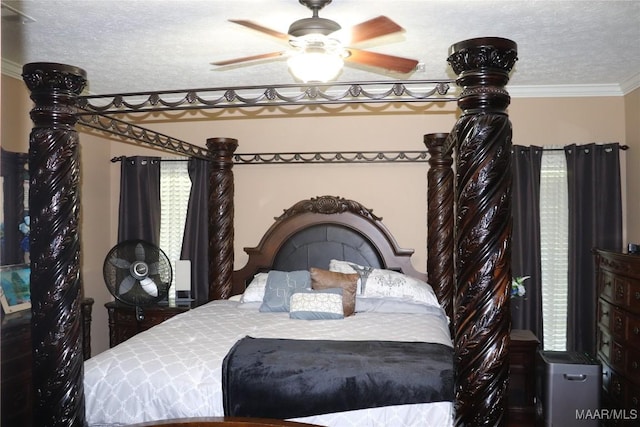 663 Hobbie Rd, Montgomery, AL 36105 - bedroom with ornamental molding, a textured ceiling, and a ceiling fan