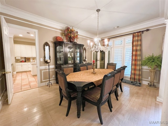 7178 Wyngrove Dr, Montgomery, AL 36117 - dining room featuring a chandelier, light wood-type flooring, and ornamental molding