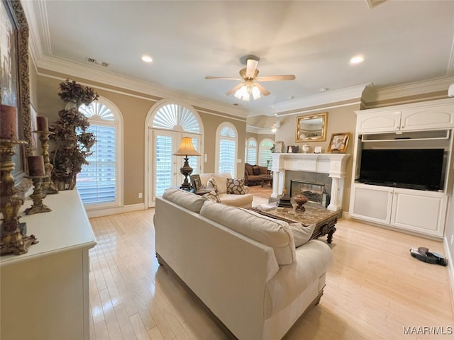 7178 Wyngrove Dr, Montgomery, AL 36117 - living area featuring ceiling fan, light wood-style floors, ornamental molding, a glass covered fireplace, and recessed lighting