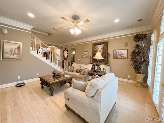 7178 Wyngrove Dr, Montgomery, AL 36117 - living area with stairway, ceiling fan, light wood-type flooring, baseboards, and crown molding