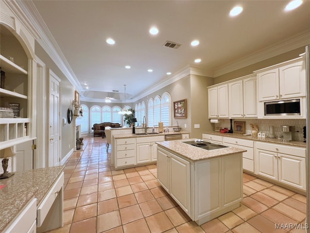7178 Wyngrove Dr, Montgomery, AL 36117 - kitchen with appliances with stainless steel finishes, a kitchen island with sink, light tile patterned flooring, a sink, and open floor plan