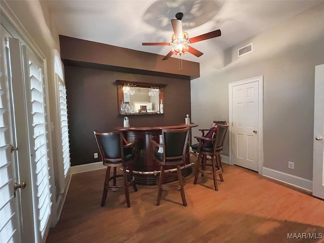 7178 Wyngrove Dr, Montgomery, AL 36117 - indoor dry bar featuring a ceiling fan, wood finished floors, and baseboards