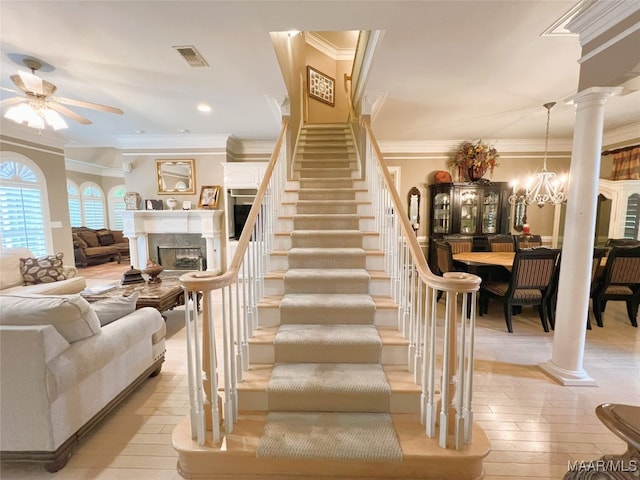 7178 Wyngrove Dr, Montgomery, AL 36117 - staircase with ornamental molding, a fireplace, a ceiling fan, decorative columns, and recessed lighting