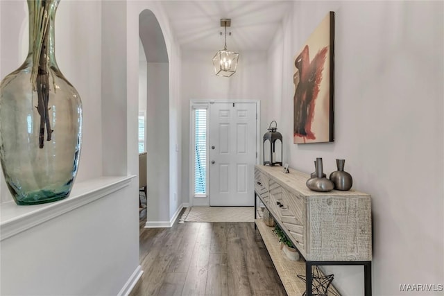 400 Lismore Pl, Montgomery, AL 36117 - foyer entrance with wood finished floors, arched walkways, a chandelier, and baseboards