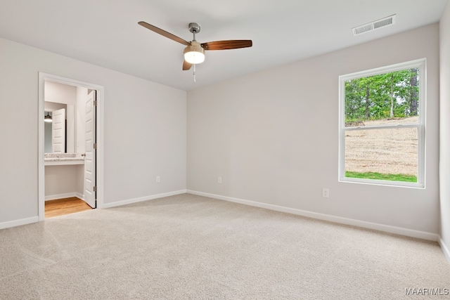 177 Canal Xing, Wetumpka, AL 36092 - unfurnished bedroom featuring carpet floors, baseboards, ensuite bathroom, and a ceiling fan