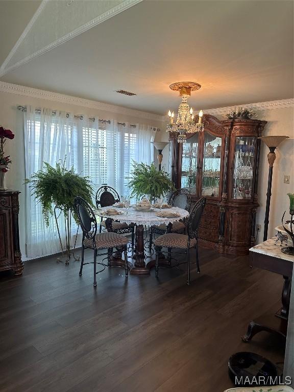 3932 Oak Ave, Montgomery, AL 36109 - dining space with a chandelier and dark wood-style floors