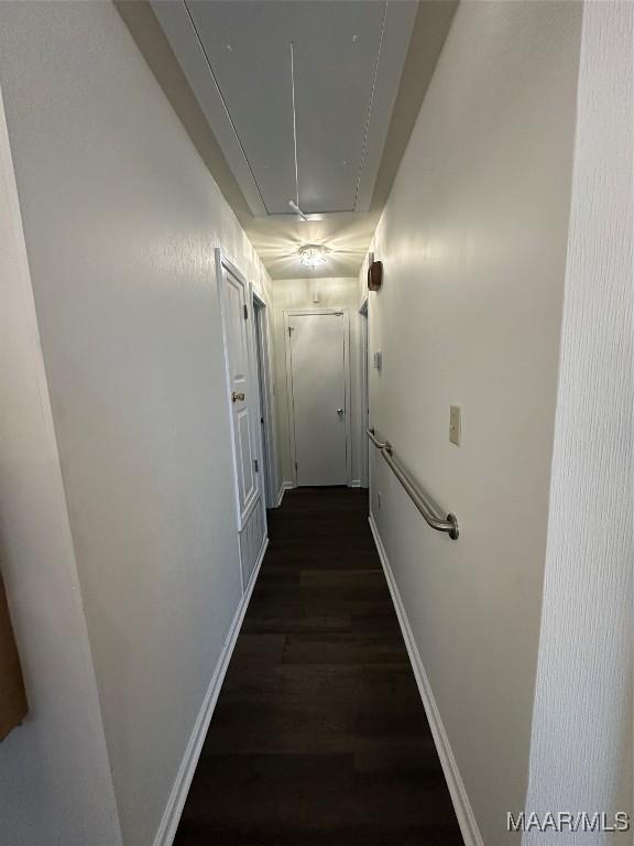 3932 Oak Ave, Montgomery, AL 36109 - corridor with attic access, dark wood-type flooring, and baseboards