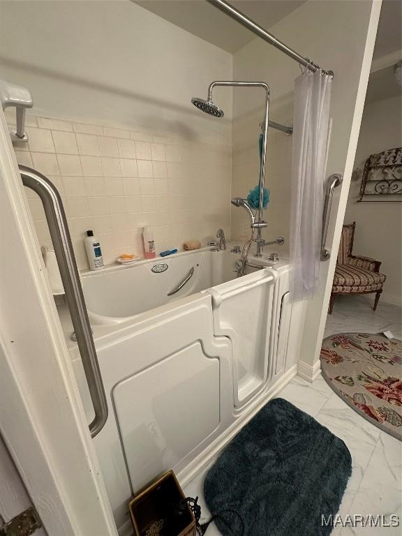 3932 Oak Ave, Montgomery, AL 36109 - full bathroom with shower / tub combo with curtain and marble finish flooring