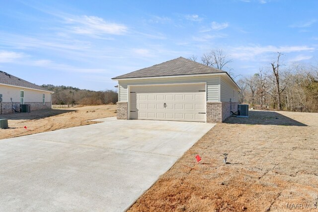 213 Canal Xing, Wetumpka, AL 36092 - view of side of home with a garage, central air condition unit, roof with shingles, and concrete driveway