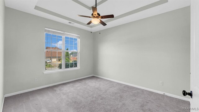 8 Honor Dr, Fort Mitchell, AL 36856 - carpeted spare room featuring ceiling fan, baseboards, and a tray ceiling