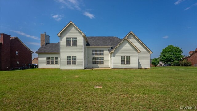 8 Honor Dr, Fort Mitchell, AL 36856 - rear view of property featuring a lawn and a shingled roof
