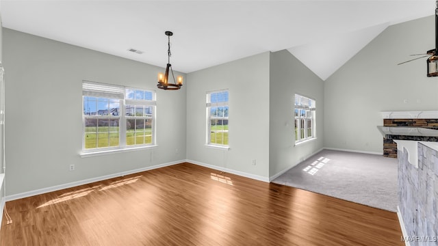 8 Honor Dr, Fort Mitchell, AL 36856 - unfurnished dining area with a chandelier, healthy amount of natural light, wood finished floors, and lofted ceiling