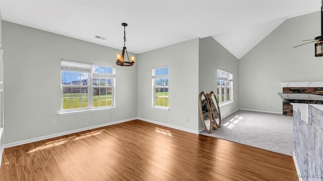 8 Honor Dr, Fort Mitchell, AL 36856 - unfurnished dining area with a chandelier, healthy amount of natural light, wood finished floors, and lofted ceiling