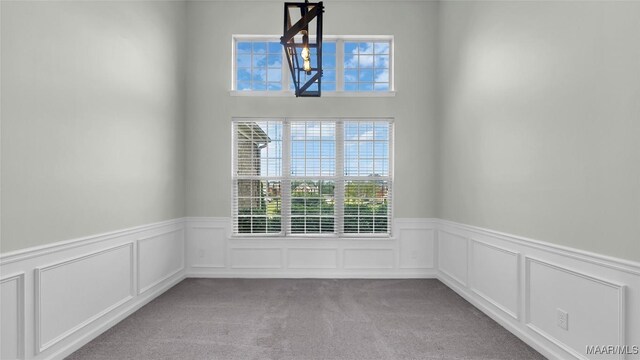 8 Honor Dr, Fort Mitchell, AL 36856 - carpeted spare room featuring healthy amount of natural light, wainscoting, and a decorative wall