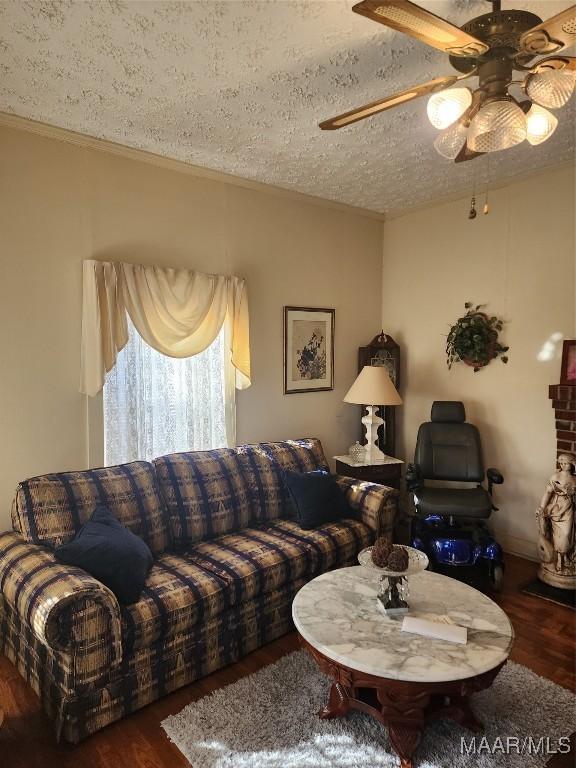 2110 Luverne St, Montgomery, AL 36104 - living area featuring wood finished floors, a textured ceiling, ceiling fan, and ornamental molding