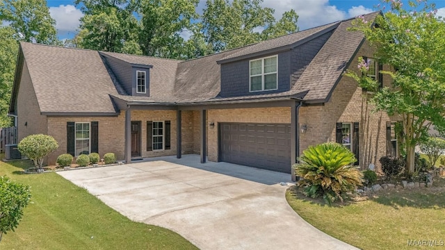 9148 Autumnbrooke Way, Montgomery, AL 36117 - view of front facade featuring a garage, concrete driveway, brick siding, a front yard, and a shingled roof
