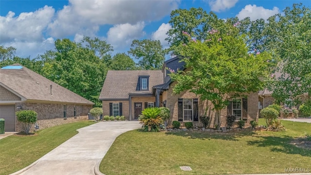 9148 Autumnbrooke Way, Montgomery, AL 36117 - view of front of house featuring brick siding, concrete driveway, and a front yard