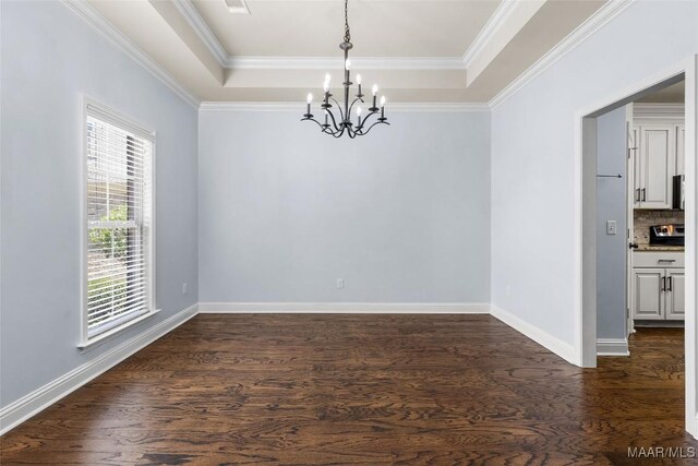 9148 Autumnbrooke Way, Montgomery, AL 36117 - spare room featuring a chandelier, a tray ceiling, dark wood-type flooring, baseboards, and ornamental molding