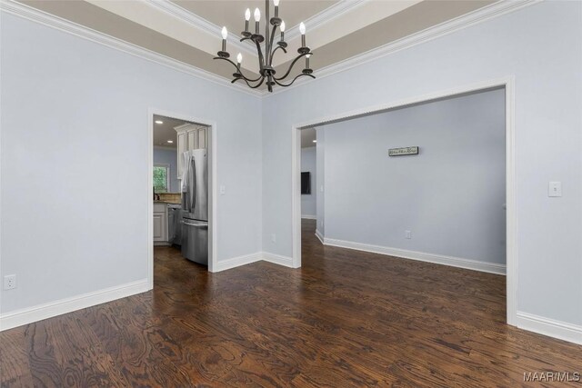 9148 Autumnbrooke Way, Montgomery, AL 36117 - empty room featuring a chandelier, dark wood finished floors, crown molding, and baseboards